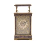 An enamelled brass carriage clock,