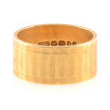 An 18 carat yellow gold wedding band, 7.2gms.