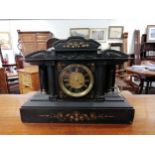 A Victorian black slate mantel clock,