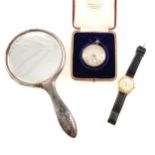 A silver pocket watch, hand mirror and Buler watch.