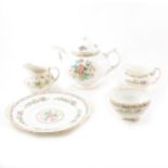 A Royal Doulton fine china "Strawberry Cream" tea set and a Coalport bone china "Ming Rose" tea set.