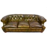 Button leather Chesterfield settee, scrolled ends, 217cm.