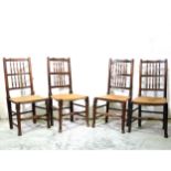 A harlequin set of five ash and stained wood spindle-back dining chairs