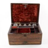 A Victorian rosewood travelling box with fitted interior,