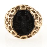 A 9 carat yellow gold black onyx signet ring.