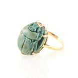 A green scarab dress ring,