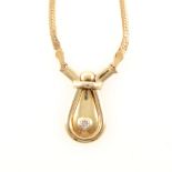 A yellow metal necklace marked 14K set with a single diamond