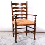 Elm and ash ladder-back elbow chair, 19th Century, shaped arms, upholstered drop-in seat, turned