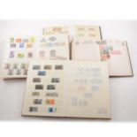 Stamps: New Ideal Album, with a small collection of pre-war world stamps