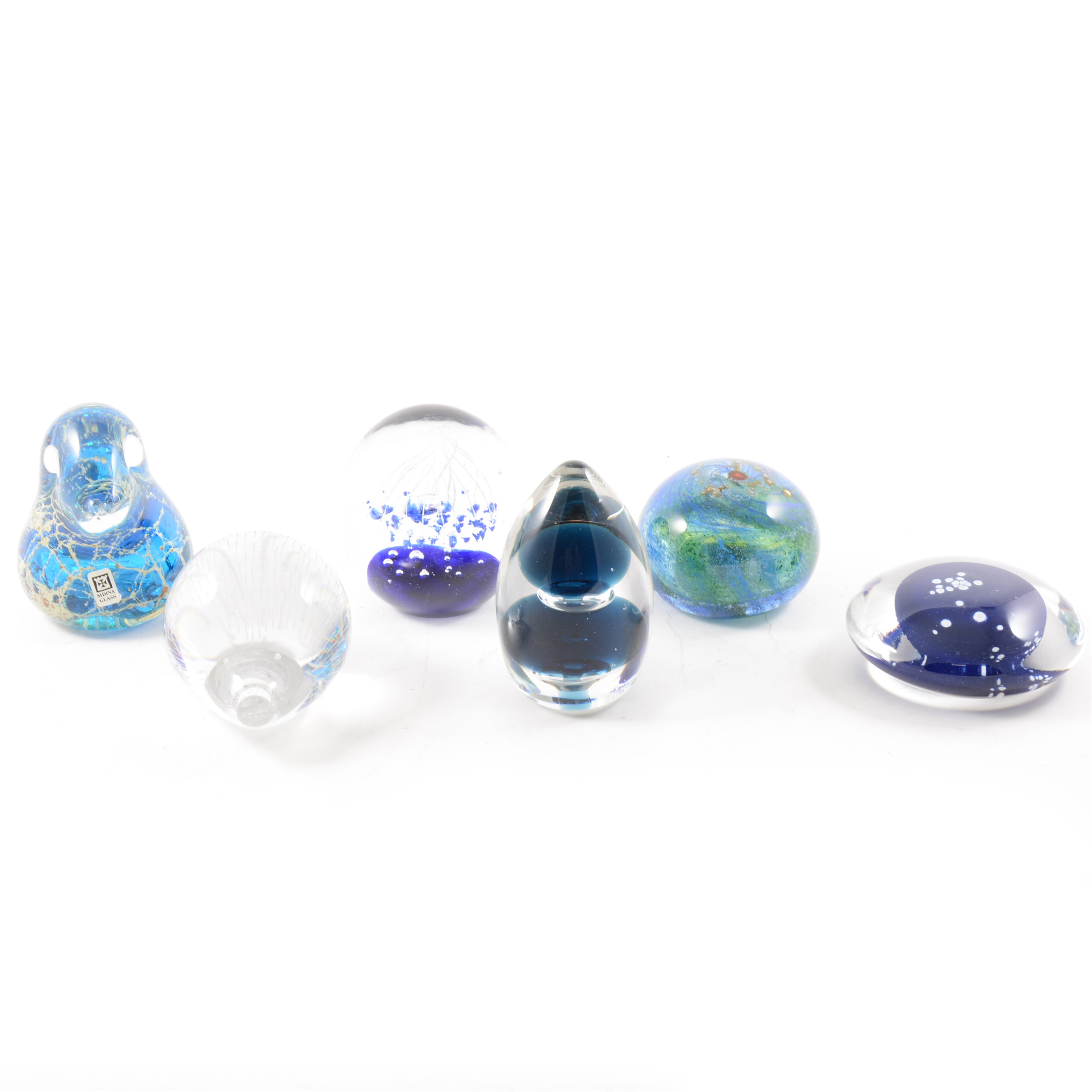 A collection of glass paperweights, to include "Hedgehog" by Kosta Boda