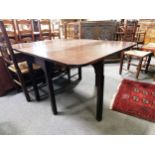 A Victorian mahogany drop-leaf dining table, ...