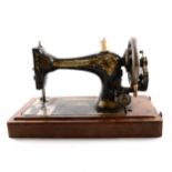 1896 singer sewing machine, walnut case.