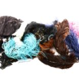 Two boxes of coloured ostrich feathers