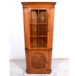 Reproduction walnut corner cabinet, moulded cornice, plain frieze, the upper section glazed