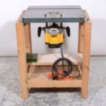 Cast iron spindle/router table with heavy duty router.