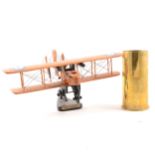 Brass aircraft engine starter cartridge No. 10 Mk.3 RLB83/7, pair of RAF napkin rings, wooden model