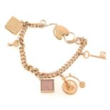 A 9 carat yellow gold charm charm bracelet with charms