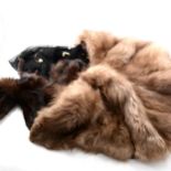 Fourteen items of fur in a Globetrotter case