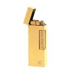 A Dunhill gold-plated cigarette lighter lighter, barley engine turned design.