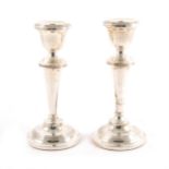 A pair of silver candlesticks,