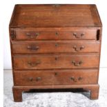 A George III oak bureau, ...