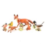 Three Beswick foxes and five Beswick birds