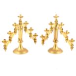A pair of lacquered brass Gothic Revival adjustable candelabra