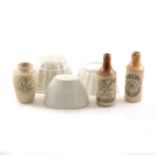 Collection of stoneware jelly moulds and bottles.