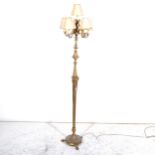 A cast brass six light floor standing candelabra