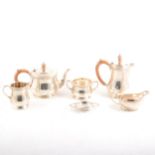 A silver four piece tea set by H Pidduck & Sons with a similar Scottish cream jug and a tea