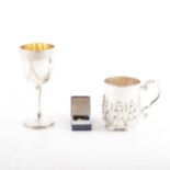 A silver Christening mug, a Victorian silver goblet and a small yellow metal tie-pin