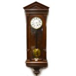 A walnut Vienna-type wall clock