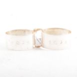 A pair of silver napkin rings by C J Vander Ltd