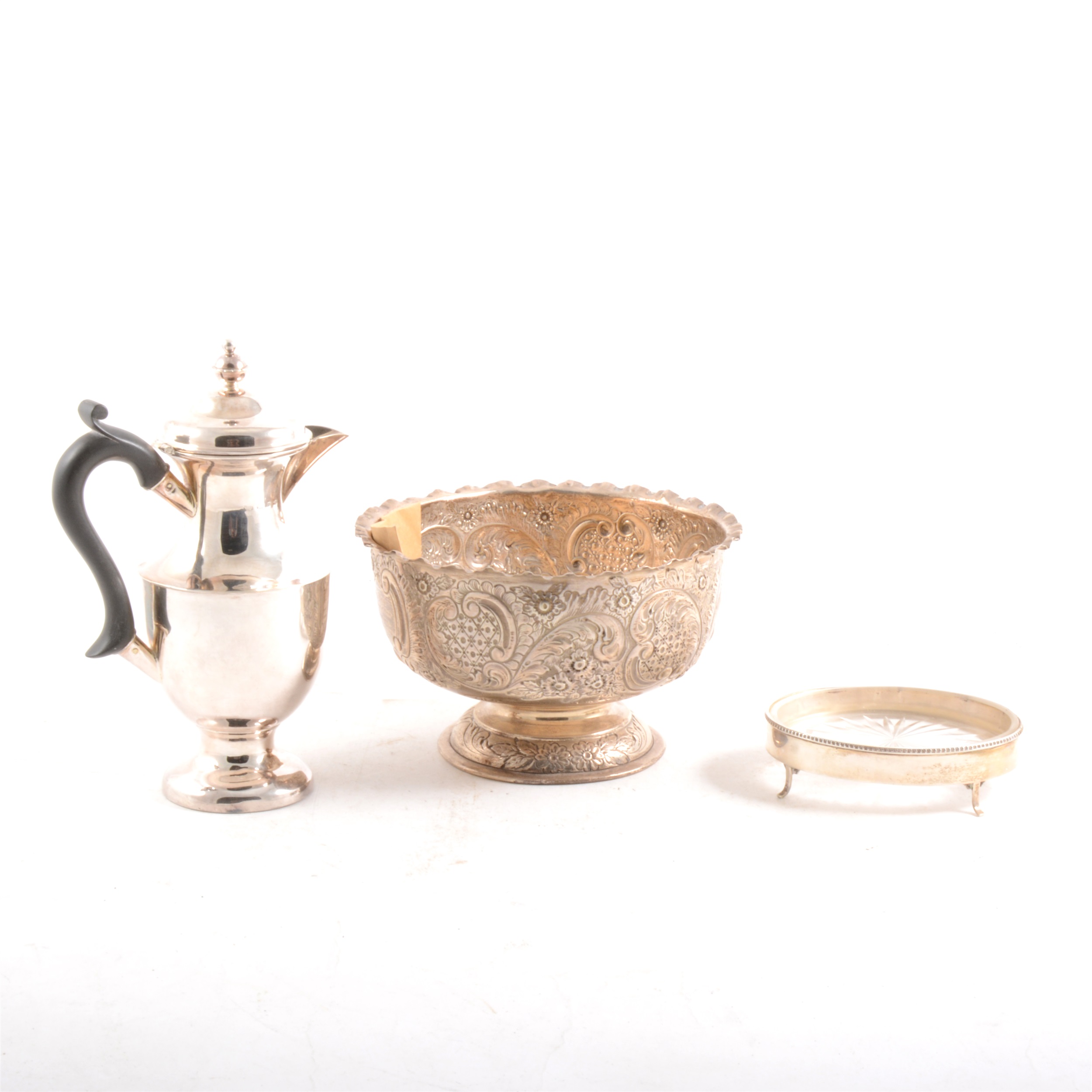 A silver repousse chased pedestal bowl, small silver coffee pot and a glass butter dish in silver