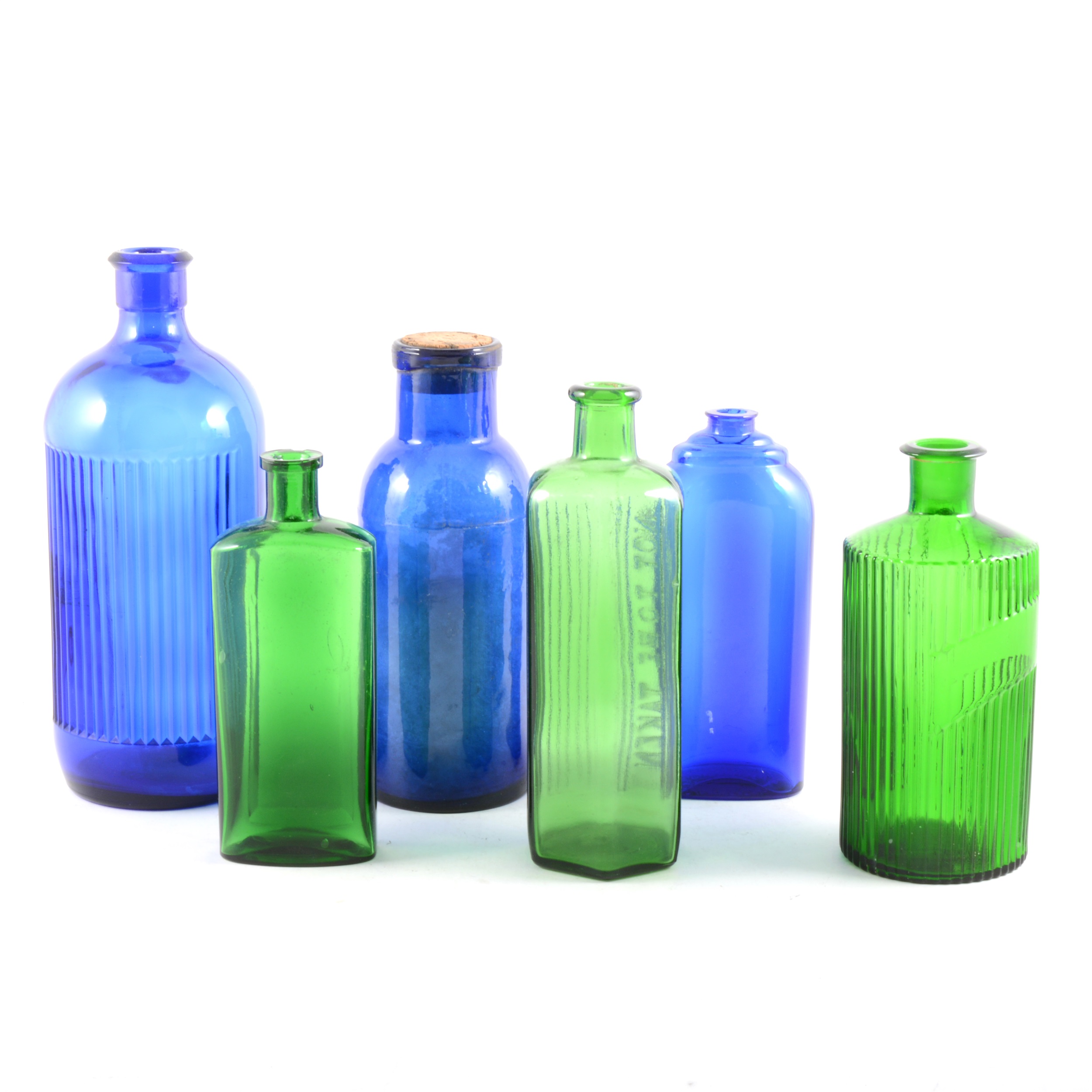 Collection of coloured glass chemist's bottles