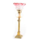 A brass Corinthian column oil lamp