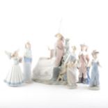 A large Lladro figure, of a lady in a tall hat, and five other Lladro figures.