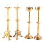 A pair of Gothic Revival gilt metal candlesticks, and a pair of pricket candlesticks