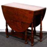 An oak gateleg table