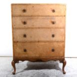 A bleached walnut chest of drawers