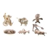 A collection of silver charms