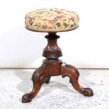 A Victorian walnut music stool