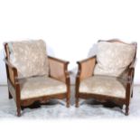 A pair of oak framed bergere easychairs