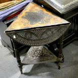 A continental carved and stained wood triangular occasional table