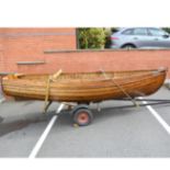12ft Clinker dinghy, "Tejay", with British Seagull outboard motor, on trailer