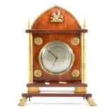 A French Empire style mahogany and brass mounted mantel clock