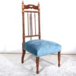 A continental walnut spindle-back nursing chair