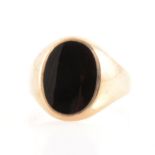 A gentleman's black onyx signet ring.
