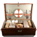 A 1920s cane motoring picnic basket, by GW Scott & Sons.