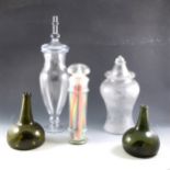 Two olive green glass onion-shape decanters, and three glass jars